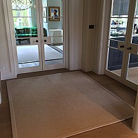 Jacaranda Hexagon Weave rug. Leather tape border.
